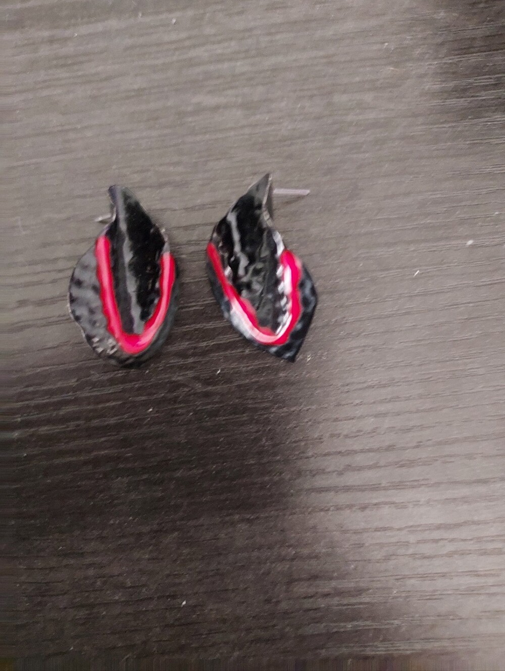 Black Leaf-Shape Stud Earrings with Red Accent